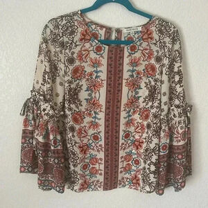 Rose + Olive Blouse Women’s Floral 3/4 sleeve with ties on the sleeve.